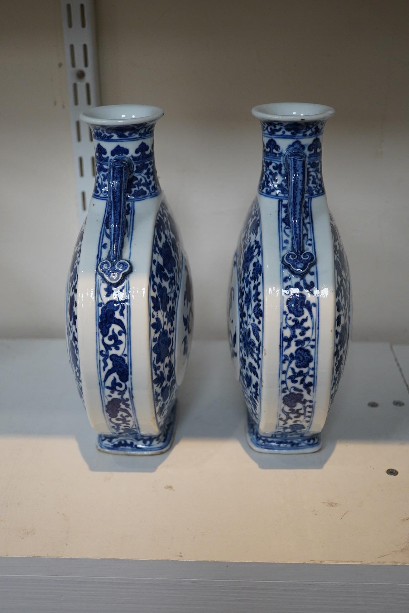 A near pair of Chinese blue and white moonflasks, bianhu, Daoguang seal marks and of the period (1821-50)